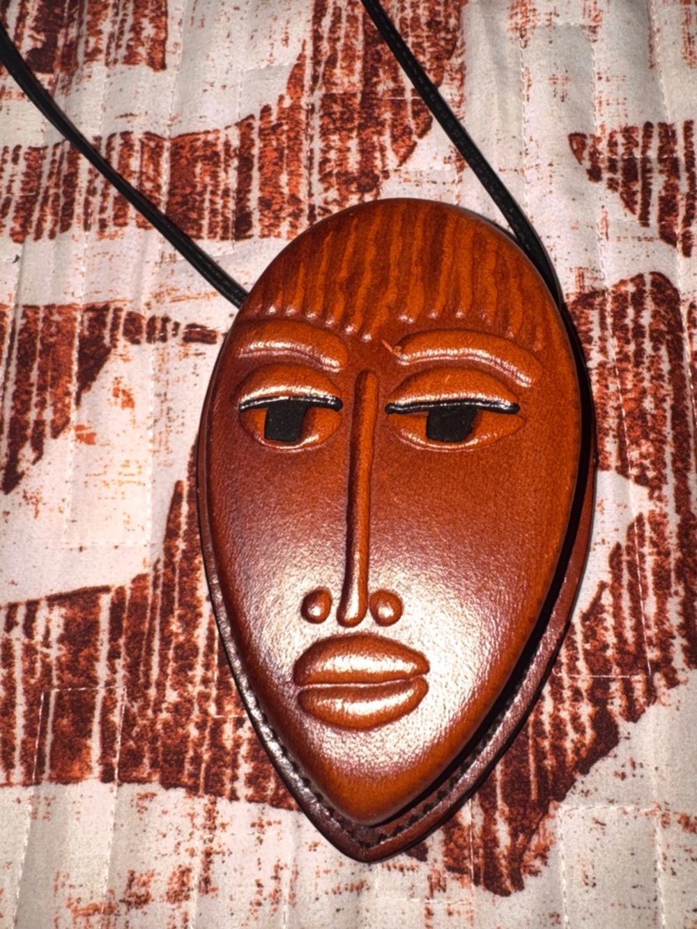 Artwear by Robbie Handcrafted LeatherCubist Face Artist in Warm Brown pouch .